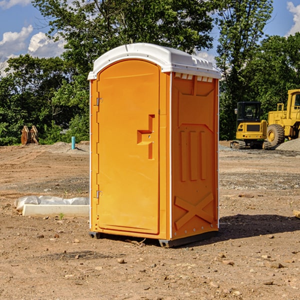 what is the cost difference between standard and deluxe porta potty rentals in Rhodes